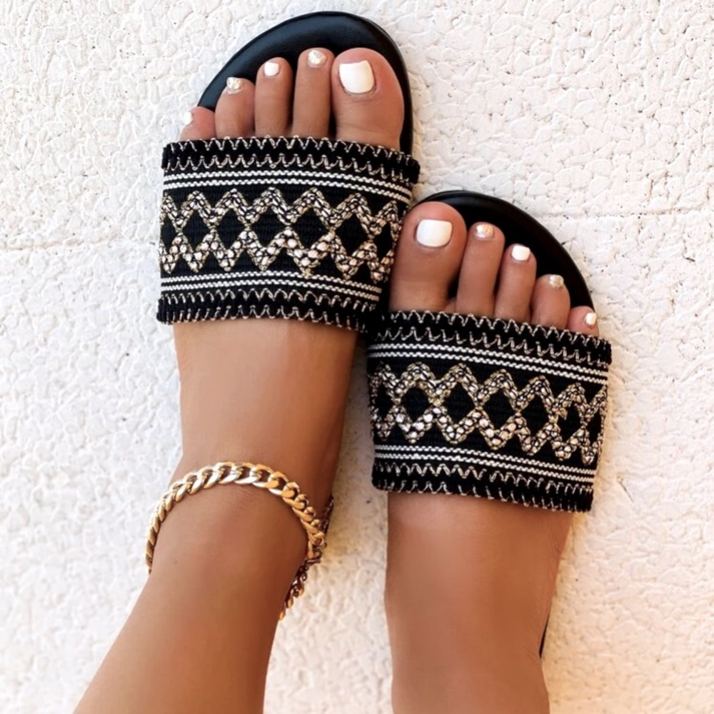 Woven slide sandal; geometric gold, black & white.